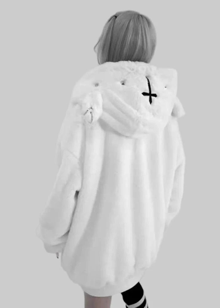 Person wearing a white coat with a hood and black cross design on a gray background, featuring the brand 'Lautaro'.