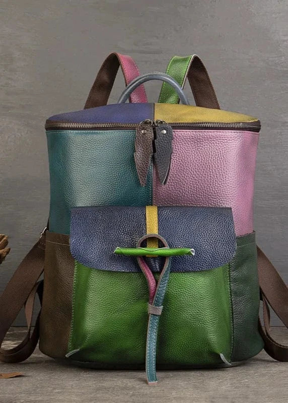 Multicolored backpack with a wooden log and decorative elements on a gray background
