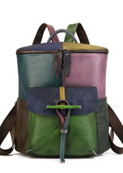 Multicolored backpack with a patchwork design on a white background