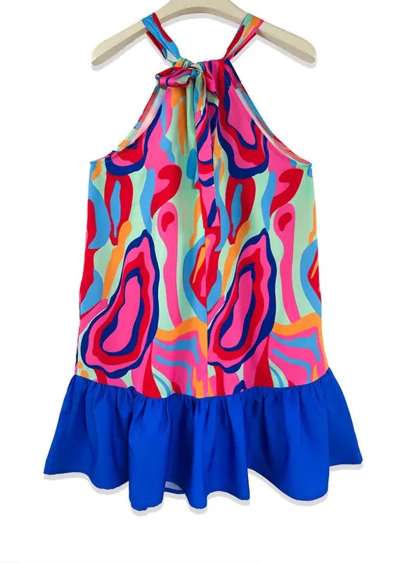 Colorful patterned dress with blue hem on a white background
