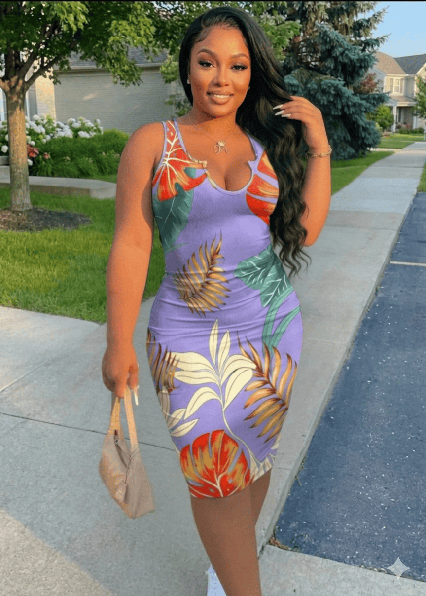 Woman in a colorful dress walking on a sidewalk
