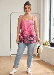 Woman wearing a pink floral tank top and jeans indoors.