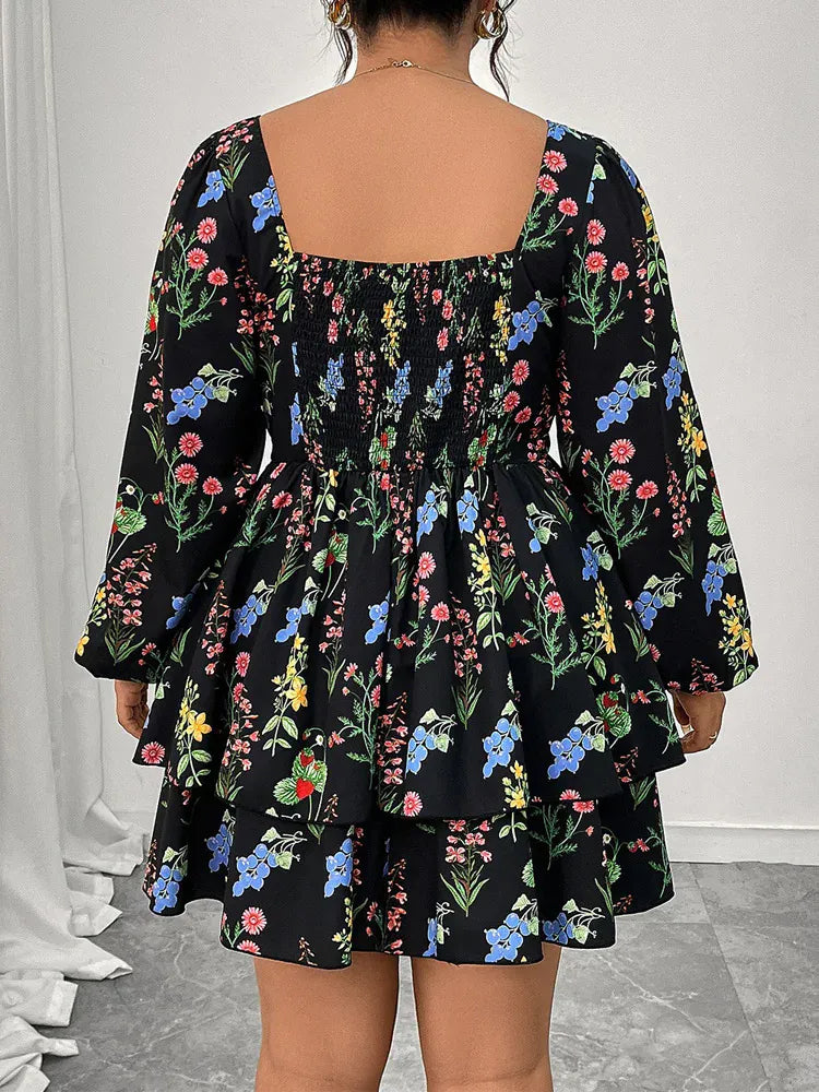 Black floral dress worn by a person with a white background