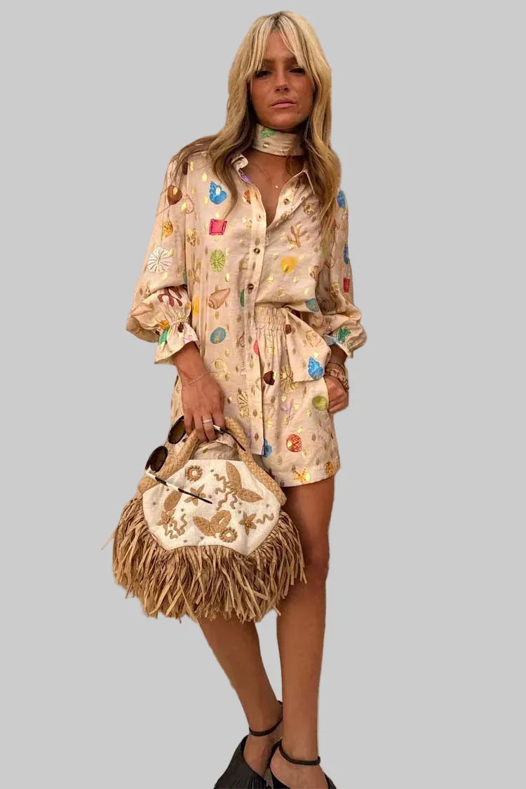 Woman holding a decorative handbag against a stone wall