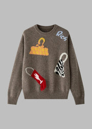 Brown sweater with colorful graphic designs on a white background