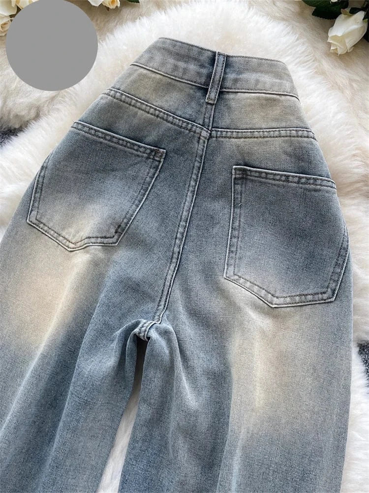 Blue jeans on a fluffy white surface with 'Sing Reiny' branding.