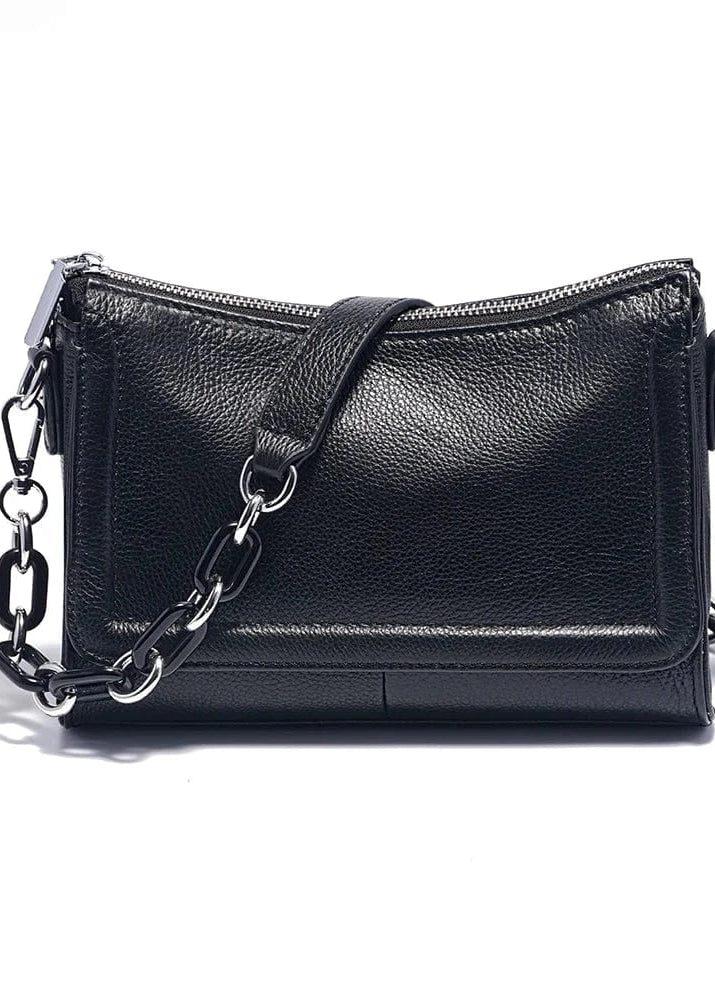 A white genuine leather top-handle bag with silver chains and a zipper closure.