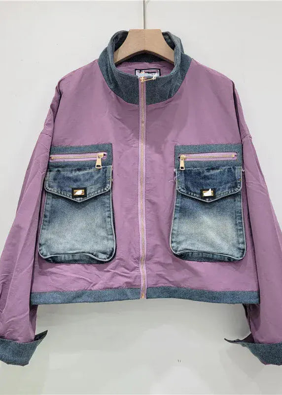 Purple jacket with denim accents on a white background