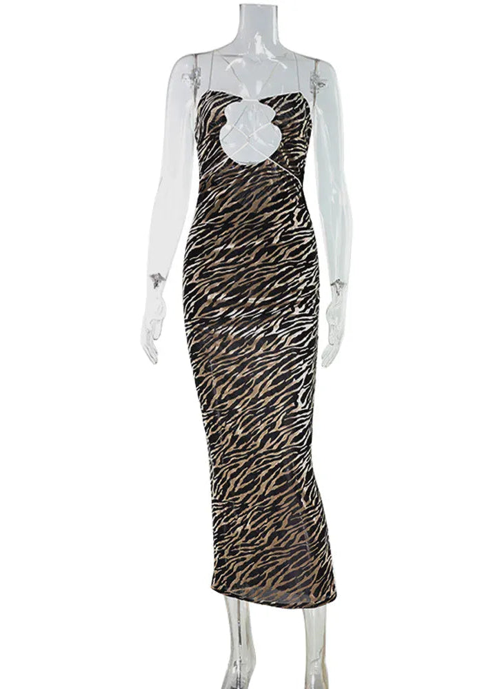 Mannequin wearing a zebra print dress on a white background