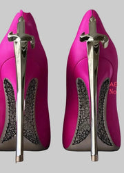 Pink high-heeled shoes with silver sword designs on a gray background, featuring the brand 'ABENGYA'.