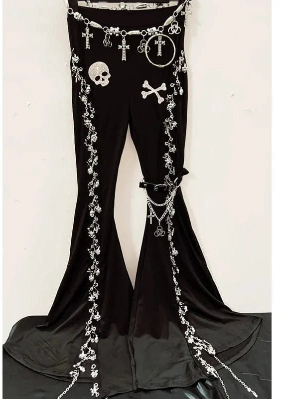 Black bell-bottom pants with skull and crossbones decorations on a white background