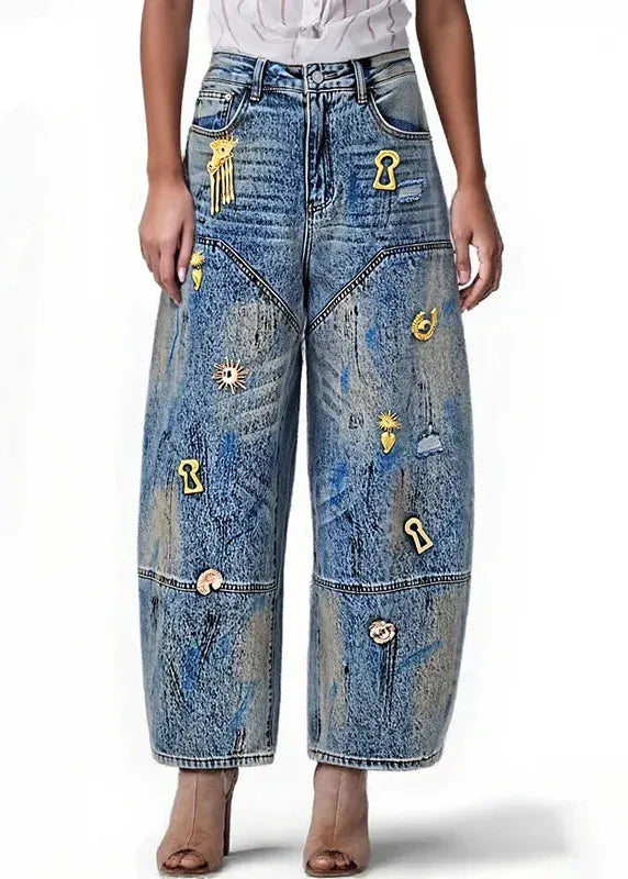 Wide-leg jeans with decorative buttons on a white background