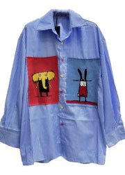 Blue striped shirt with cartoon character patches on a white background