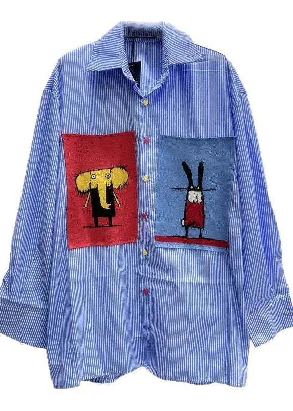 Blue striped shirt with cartoon character patches on a white background