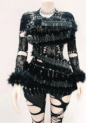 Black gothic-style outfit with intricate details on a mannequin against a white background