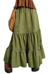 Green tiered dress with brown accents on a white background