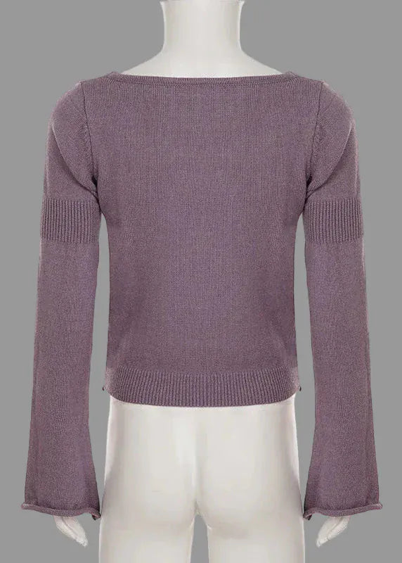 Purple sweater on a mannequin against a white background