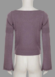 Purple sweater on a mannequin against a white background