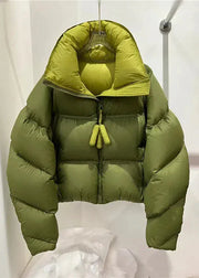 Green puffer jacket hanging against a white background