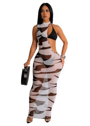Woman wearing a camouflage dress with 'passion goddess' text above