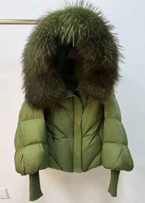 Green puffer jacket with fur hood on a white background