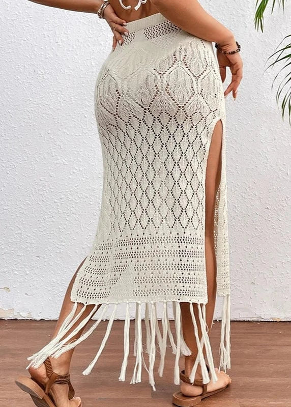 White crochet skirt with fringe details on a white background
