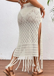 White crochet skirt with fringe details on a white background