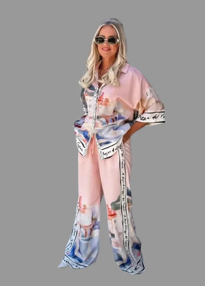 Woman wearing a patterned outfit with sunglasses in an outdoor setting