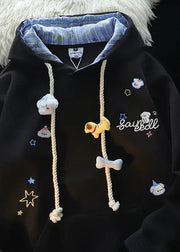 Black hoodie with cartoon character designs and text on a dark background