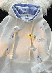 Light gray hoodie with cartoon character designs on a black background