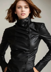 Woman wearing a black leather jacket against a neutral background