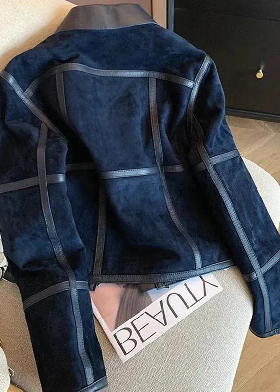 Blue textured jacket on a chair with a magazine underneath