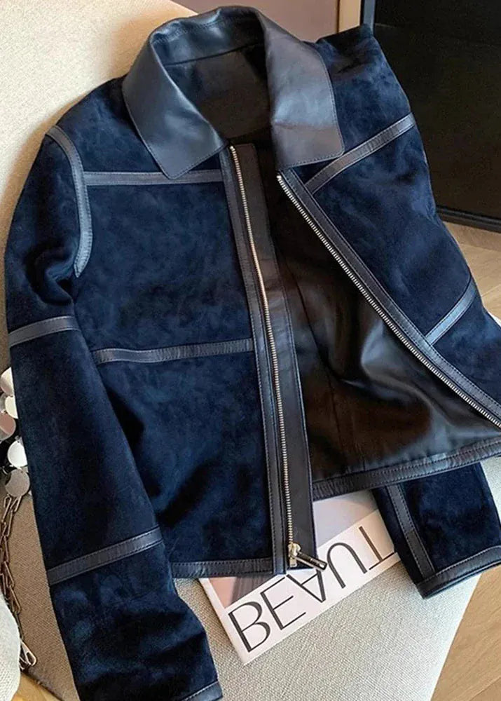 Blue jacket with gray accents on a wooden floor