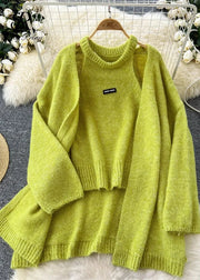 Green sweater on a hanger with decorative background