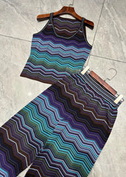 Striped tank top and leggings set on a hanger against a tiled floor background