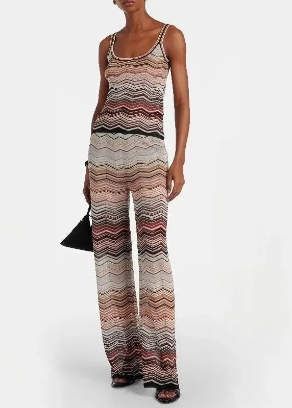 Woman wearing a patterned jumpsuit on a white background