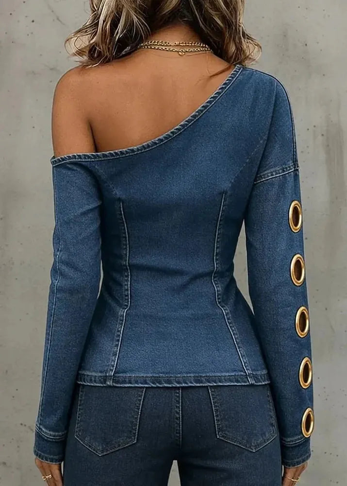 Blue denim one-shoulder top with gold buttons on a plain background