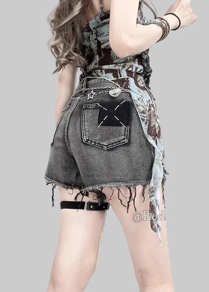 Person wearing a denim skirt with a star pocket design on a plain background