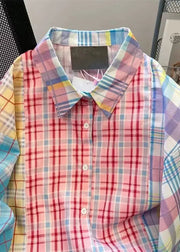 Colorful plaid shirt with a tag on a black background