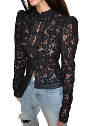 Black lace long-sleeve top worn by a person on a white background