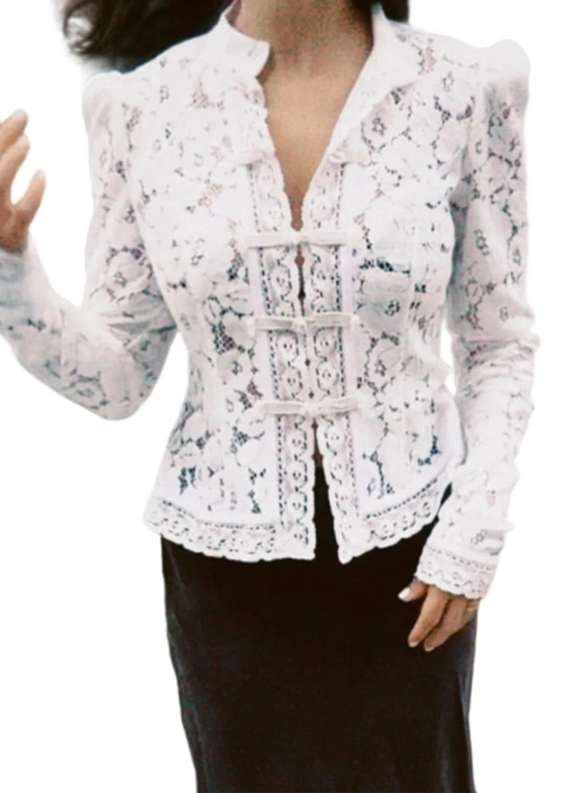 White lace blazer worn by a person on a white background