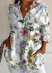 Floral patterned shirt with colorful flowers on a plain background