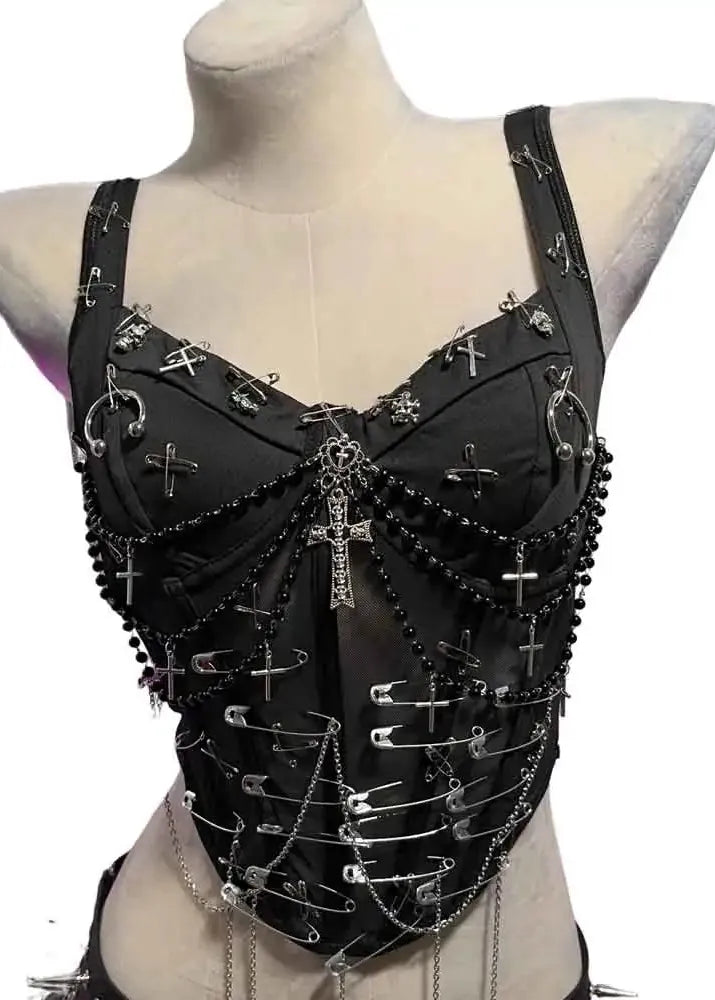 Black leather top with metal embellishments on a mannequin against a white background