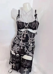 Black lace dress with silver chain and symbol detailing on a mannequin against a white background