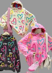 Colorful hoodies with heart designs on mannequins against a neutral background, featuring the brand 'Amy & Benton'.