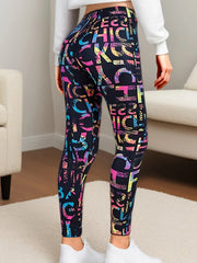 Person wearing colorful patterned leggings in a room with a neutral background