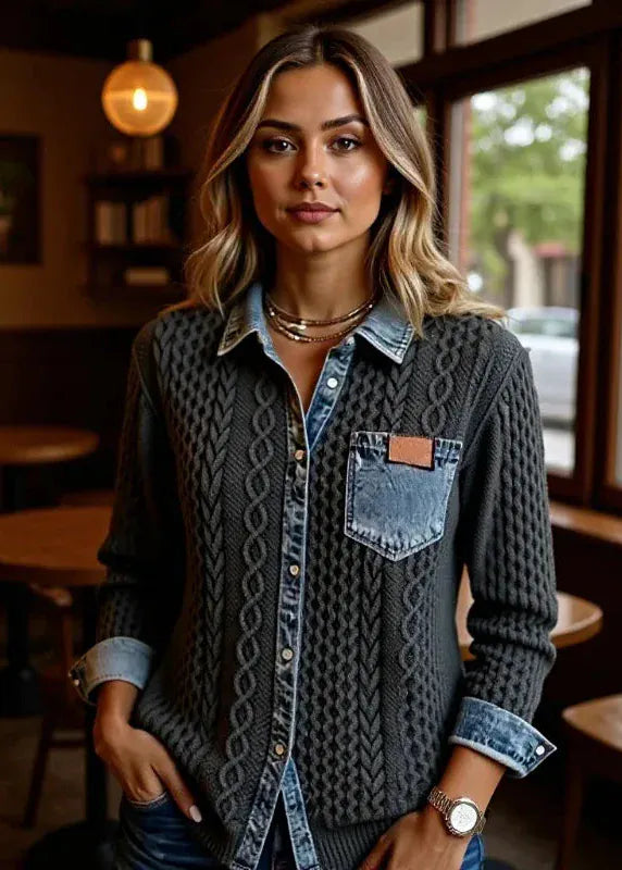 Woman standing in a casual setting with tables and chairs in the background
