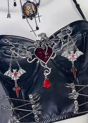 Black leather corset with silver and red embellishments on a white background