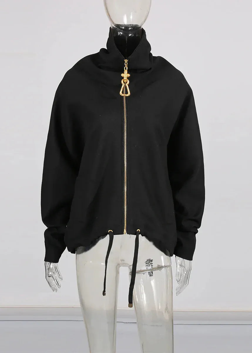 Black hoodie with gold zipper on a mannequin against a white background
