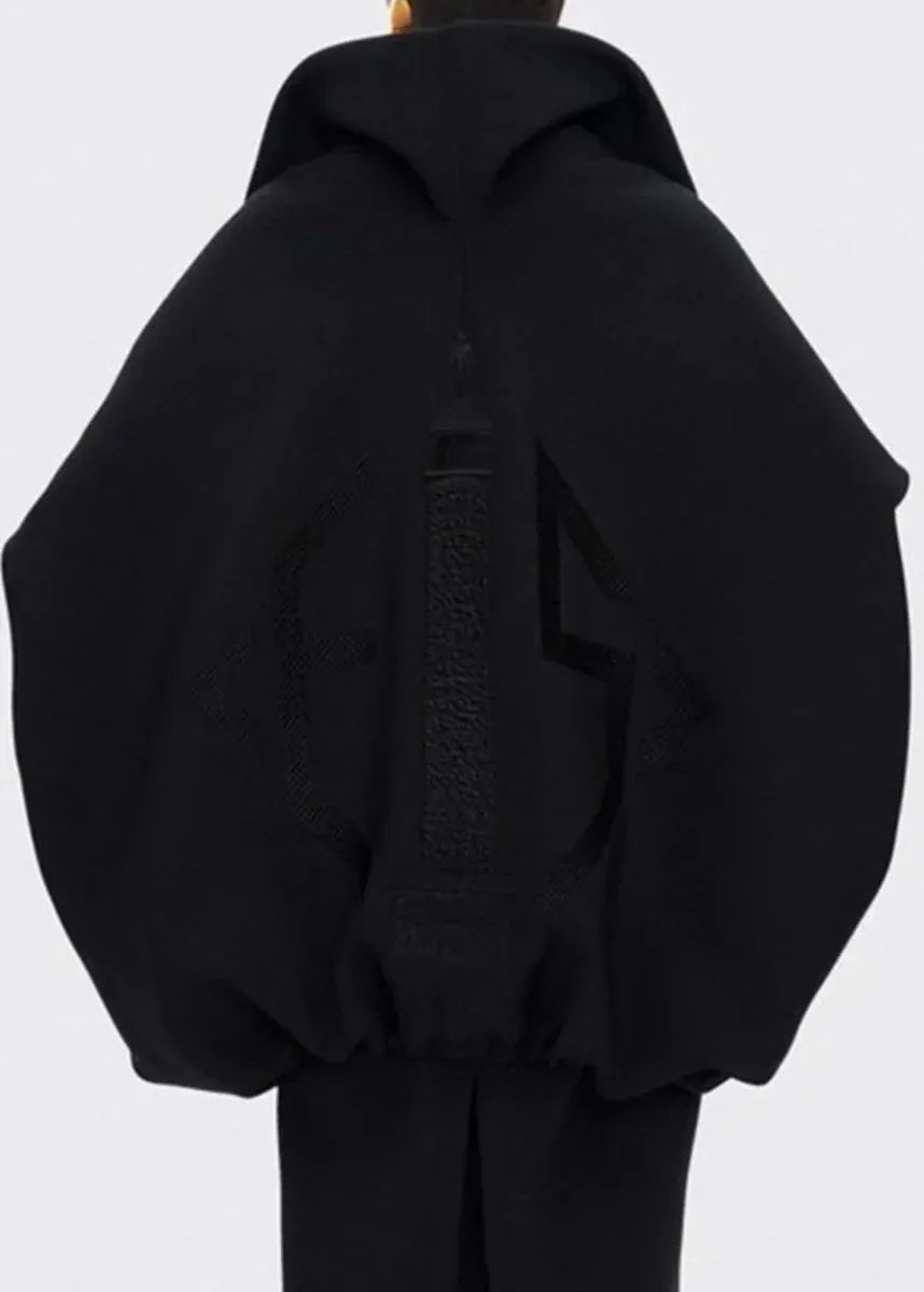 Black hoodie on a mannequin against a white background